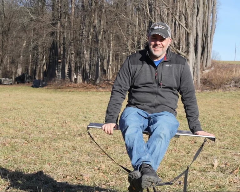 Tom from OutdoorMiles sits on his TakTable™
